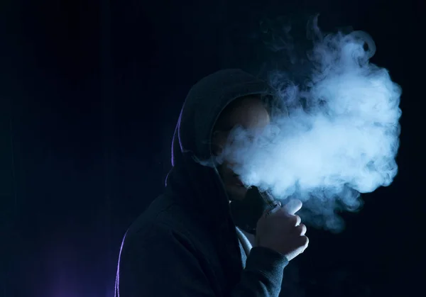 depositphotos_151665304-stock-photo-man-vape-an-electronic-cigarette